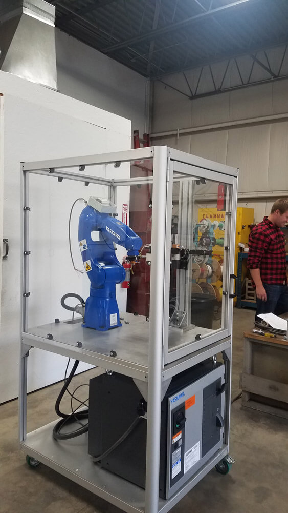 T-slot aluminum extrusion enclosed robot cell for industrial automation
